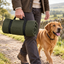 Artemis dog travel bed rolled securely with straps and carried by its integrated handle