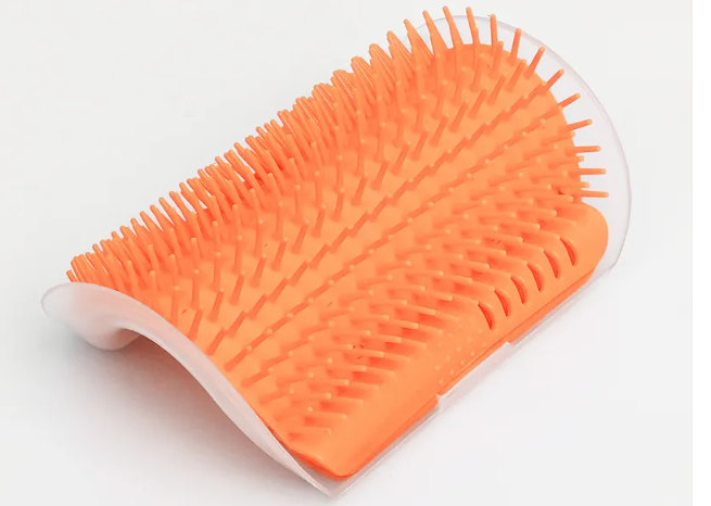 Close-up of the corner cat scratcher's arched bristles in orange